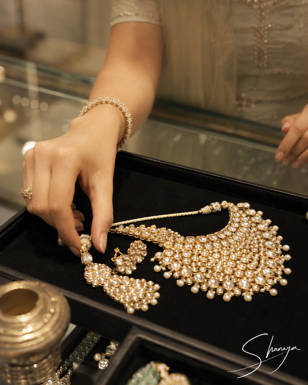 Shanaya in the store, browsing / trying on jewellery