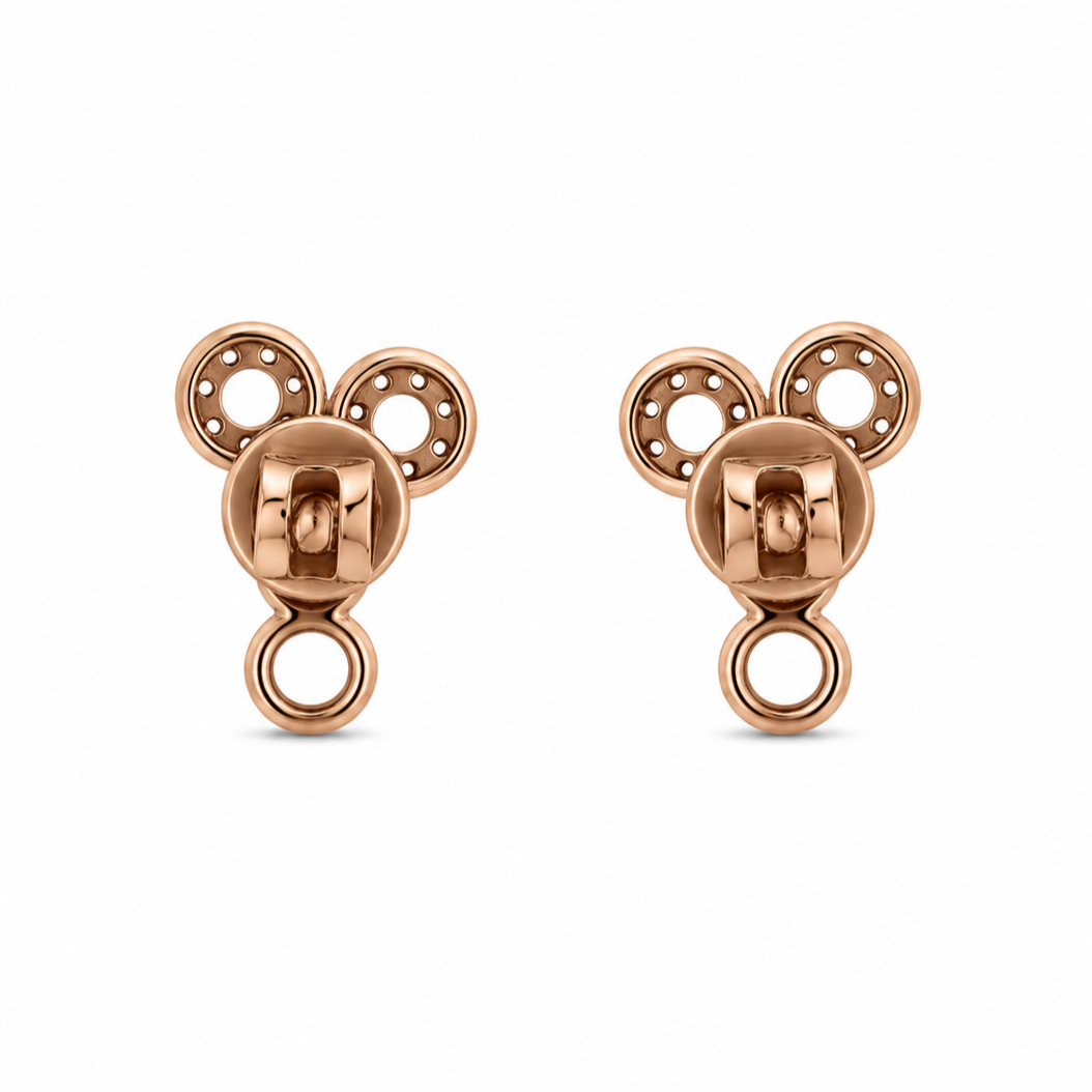 A pair of rose gold stud earrings shaped like a stylized mouse head silhouette, featuring circular details, shown on a plain white background.